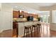 Kitchen with breakfast bar, wooden stools, and stainless steel appliances at 792 Eldridge Loop, Cary, NC 27519