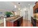 Spacious kitchen featuring a bar with granite countertops and stainless appliances at 792 Eldridge Loop, Cary, NC 27519