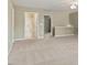 Spacious carpeted living room has open access to a bathroom and the rest of the home at 792 Eldridge Loop, Cary, NC 27519