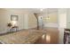 Open living space showcases hardwood floors, a stylish ceiling fan and stairs to the second level at 792 Eldridge Loop, Cary, NC 27519