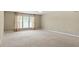 Spacious living room with neutral carpet, natural light, and multiple climate control vents at 792 Eldridge Loop, Cary, NC 27519