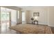 Bright living room with hardwood floors, a large rug, and views into other rooms at 792 Eldridge Loop, Cary, NC 27519