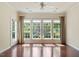 Bright living room with hardwood floors, large windows, and an open feel at 792 Eldridge Loop, Cary, NC 27519