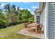 Outdoor patio features green foliage, a wood dining table, and a black metal fence at 792 Eldridge Loop, Cary, NC 27519