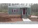 Charming single-story home with gray siding, burgundy shutters, and a landscaped yard at 82 Whisper Ln, Pittsboro, NC 27312