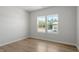 Bright bedroom featuring wood-look floors and large windows at 90 Cordoba Dr, Franklinton, NC 27525