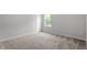 Bedroom featuring neutral carpet, a window, and a white door at 90 Cordoba Dr, Franklinton, NC 27525