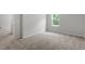 Bedroom featuring neutral carpet, a window, and a white door at 90 Cordoba Dr, Franklinton, NC 27525