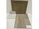Interior design finishes featuring cabinet paint, countertop sample, and wood flooring for a modern home at 90 Cordoba Dr, Franklinton, NC 27525