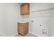 Functional laundry room featuring cabinets, counter space, and washer/dryer hookups at 90 Cordoba Dr, Franklinton, NC 27525