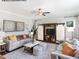 Inviting living room with stylish sofas, decorative pillows, and a custom entertainment center with sliding barn doors at 90 Cordoba Dr, Franklinton, NC 27525