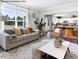 Comfortable living room showcasing natural light, modern furnishings, and an open floor plan connected to the kitchen at 90 Cordoba Dr, Franklinton, NC 27525