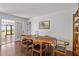 Dining room with wooden table, chairs, and view to a screened porch at 9400 Wheelers Church E Rd, Hurdle Mills, NC 27541