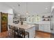 Bright kitchen with large island, pendant lighting, and stainless steel appliances at 9400 Wheelers Church E Rd, Hurdle Mills, NC 27541