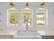 Kitchen sink featuring stone countertops, white shiplap and stainless faucet at 9400 Wheelers Church E Rd, Hurdle Mills, NC 27541