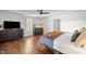 Bright and airy main bedroom featuring hardwood floors, shiplap walls, and abundant natural light from a large window at 9400 Wheelers Church E Rd, Hurdle Mills, NC 27541