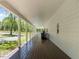 Long, covered porch with comfortable rocking chairs and scenic views of the surrounding landscape at 9400 Wheelers Church E Rd, Hurdle Mills, NC 27541