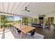 Spacious screened porch featuring a dining area and cozy sitting area with a stone fireplace at 9400 Wheelers Church E Rd, Hurdle Mills, NC 27541