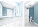 Bright bathroom with a granite vanity, stylish fixtures, and tile floors at 1023 Laura Johnson Rd, Pittsboro, NC 27312