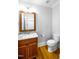 Cozy bathroom showcasing wood vanity with granite counter and white fixtures at 1023 Laura Johnson Rd, Pittsboro, NC 27312