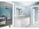 Bright bathroom with a granite vanity, stylish fixtures, and tile floors adjacent to bedroom at 1023 Laura Johnson Rd, Pittsboro, NC 27312