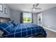 Comfortable bedroom features a ceiling fan, ample light, and closet space at 1023 Laura Johnson Rd, Pittsboro, NC 27312