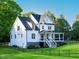 Elegant two-story home with a covered porch, landscaped yard and fenced perimeter at 1023 Laura Johnson Rd, Pittsboro, NC 27312