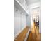 Hallway featuring wood floors and a custom built-in storage bench at 1023 Laura Johnson Rd, Pittsboro, NC 27312