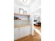 Hallway featuring built-in cabinets and shelves leading to a bedroom at 1023 Laura Johnson Rd, Pittsboro, NC 27312