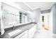 Elegant main bathroom features double sink vanity, marble floors, and glass shower at 1023 Laura Johnson Rd, Pittsboro, NC 27312