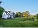 Sprawling green yard surrounding a beautiful modern farmhouse, fenced for privacy at 1023 Laura Johnson Rd, Pittsboro, NC 27312
