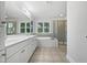 Spacious bathroom featuring a soaking tub, walk-in shower, and double vanity sink at 103 Loch Ryan Way, Cary, NC 27513