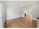 Bright living room with hardwood floors, fireplace, and an open floor plan at 103 Loch Ryan Way, Cary, NC 27513