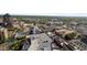 A scenic aerial view of a vibrant city showcases buildings, parking decks, and a pool at 110 N Corcoran St # 2101, Durham, NC 27701