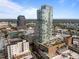 Aerial view showing building architecture, greenery, and neighborhood views at 110 N Corcoran St # 2101, Durham, NC 27701