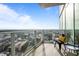 Balcony view overlooking the city with glass railings at 110 N Corcoran St # 2101, Durham, NC 27701