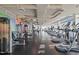Modern gym with state-of-the-art fitness equipment, sleek black flooring, and colorful accent wall at 110 N Corcoran St # 2101, Durham, NC 27701