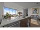 Sleek kitchen boasts quartz counters, wood cabinets, and stainless steel appliances at 110 N Corcoran St # 2101, Durham, NC 27701