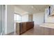 Modern kitchen featuring an island with stainless steel appliances and hardwood floors at 110 N Corcoran St # 2101, Durham, NC 27701