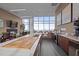 Resident kitchen with expansive countertops, stainless appliances, large windows, and breakfast bar at 110 N Corcoran St # 2101, Durham, NC 27701