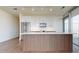 Modern kitchen with a large island and stainless steel appliances at 110 N Corcoran St # 2101, Durham, NC 27701