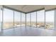 Bright living room features large windows with city views and hardwood floors at 110 N Corcoran St # 2101, Durham, NC 27701