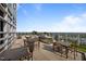 Enjoy the city views from this rooftop terrace with stainless grill, bar, and dining tables at 110 N Corcoran St # 2101, Durham, NC 27701