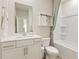 Clean bathroom with white cabinets, a shower-tub combo, and ample counter space at 1120 Landen Creek Ln, Zebulon, NC 27597