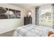 Cozy bedroom with baseball themed wall art, large window, and soft carpet at 1120 Landen Creek Ln, Zebulon, NC 27597