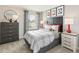 Well-lit bedroom is decorated with a sports theme, including a football and sports memorabilia at 1120 Landen Creek Ln, Zebulon, NC 27597