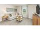 Comfortable living room area with a sectional sofa, a modern TV, and plenty of space for relaxation at 1120 Landen Creek Ln, Zebulon, NC 27597