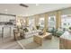 Bright living area with a kitchen island, a dining space, comfortable seating, and ample natural light at 1120 Landen Creek Ln, Zebulon, NC 27597