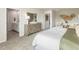 Bright main bedroom features a bathroom and dressing area for added privacy and functionality at 1120 Landen Creek Ln, Zebulon, NC 27597