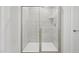 Modern bathroom featuring a glass enclosed shower with chrome hardware and ceramic tile surround at 1121 Landen Creek Ln, Zebulon, NC 27597